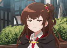 a girl with brown hair and a red tie making a funny face
