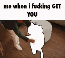 a man is standing next to a white cat .