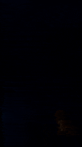 a blue lightning bolt in the dark with a blue background