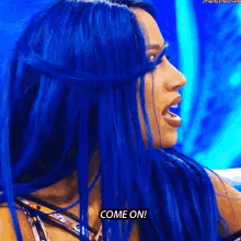 a woman with blue hair is screaming and saying `` come on '' .