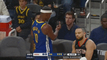 a basketball player wearing a number 10 jersey giving the middle finger