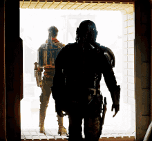 two soldiers are standing in front of a window