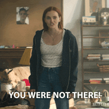 a woman standing in a living room with the words you were not there