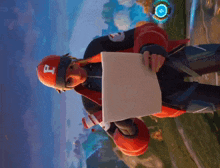 a man wearing a helmet with the letter p on it is holding a piece of paper