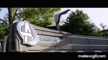 a sign for the avengers campus is displayed in front of trees