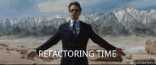 a man in a suit and tie stands in front of mountains with the words " refactoring time " on the bottom