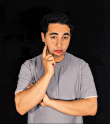 a young man with red lipstick on his face is making a funny face