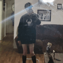a person taking a selfie in front of a mirror