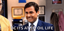 a man in a suit and tie is making a funny face with the words bc its at 5 % oil life .