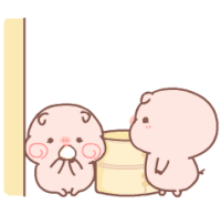 a couple of pigs standing next to each other next to a bucket .