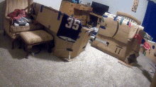 a cardboard box with the number 35 on it in a room