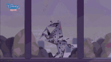 dalmatian dogs in a cage with the disney channel logo