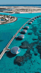 an aerial view of a bridge in the middle of the ocean