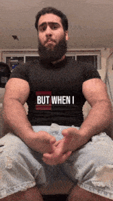 a man with a beard wears a shirt that says but when i