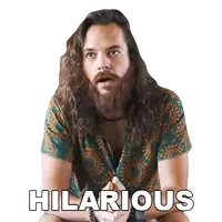 a man with long hair and a beard is wearing a hilarious shirt