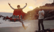 a man in a superman cape is jumping in the air while another man watches