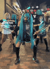 a group of people dressed in costumes are dancing on a brick sidewalk with a caption that says " tik tok "
