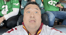 a man wearing a white and red jersey with the number 7 on it