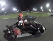 a blurred image of a person riding a motorcycle