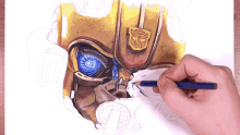 a person is drawing a picture of a transformer with a blue eye