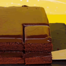 a piece of chocolate cake is sitting on a table