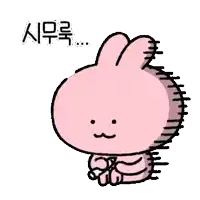 a pink rabbit is sitting down and crying with a tear coming out of its eye .