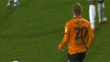 a soccer player with the number 20 on the back of his shirt