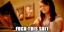 a woman is typing on a laptop with the words " fuck this shit " written below her