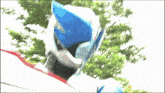a blurred image of a person wearing a blue and white costume