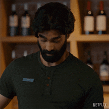 a man with a beard is wearing a name tag that says ' lee ' on it
