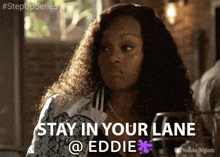 a woman with curly hair says stay in your lane