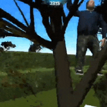 a man is hanging from a tree with a time of 12:15 on the screen