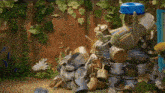 a stuffed elephant is sitting on top of a pile of trash