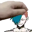 a person is petting a person 's head with a blanket .