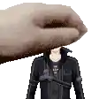 a pixel art of a person 's head being held by a hand .