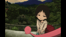 a girl with a sad look on her face is holding a pink octopus