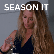 a woman is holding a bottle with the words season it written above her