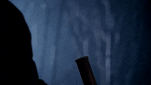 a dark blue background with a silhouette of a person