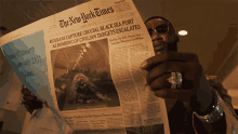 Reading A Newspaper Gucci Mane GIF - Reading A Newspaper Gucci Mane Publicity Stunt Song GIFs