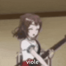 a blurred image of a girl playing a guitar with the word viole written on the bottom .