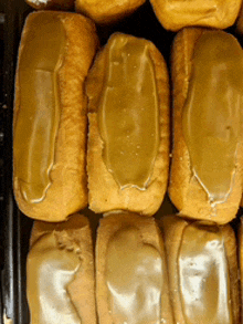 a bunch of doughnuts with caramel icing on top