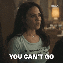 a woman wearing a t-shirt that says " a woman 's place " says you can 't go