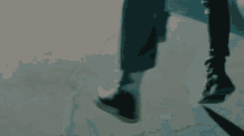 a person walking on a concrete surface with their shadow visible
