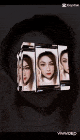 a woman 's face is displayed in a cube on a cell phone