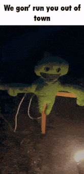 a scarecrow with the words we gon ' run you out of town on it
