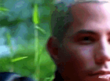 a close up of a man 's face with rbd.gif written below it