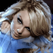 a close up of a woman 's face with blonde hair
