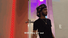 a man standing in front of a door with the words " with they a 1 * out "