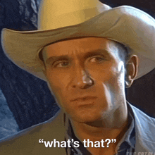 a man in a cowboy hat says " what 's that ? "