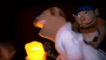 a puppet with a pencil in his mouth is holding a light